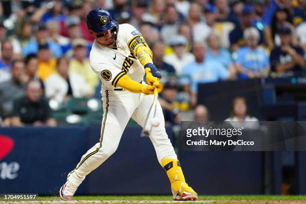 William Contreras of the Milwaukee Brewers hits a single in the first inning during Game 1 of the Wild Card Series between the Arizona Diamondbacks...