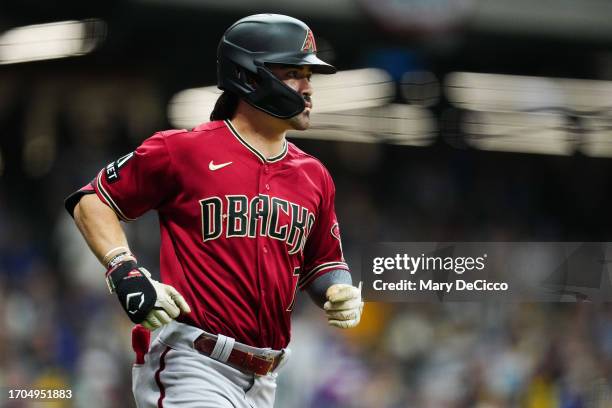 Corbin Carroll of the Arizona Diamondbacks rounds the bases after hitting a two-run home run in the third inning during Game 1 of the Wild Card...