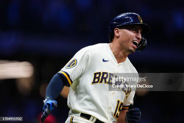 Tyrone Taylor of the Milwaukee Brewers reacts after hitting a two-run home run in the second inning during Game 1 of the Wild Card Series between the...