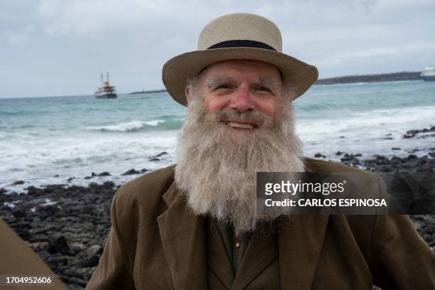 Kenneth Noll, in the costume of the English naturalist, geologist, and biologist Charles Robert Darwin, poses for a picture at the beach in Puerto...