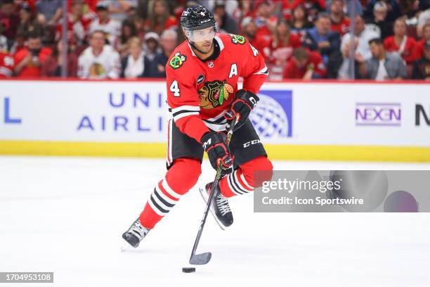 Chicago Blackhawks defenseman Seth Jones controls the puck during a game between the Detroit Red Wings and the Chicago Blackhawks on October 3, 2023...