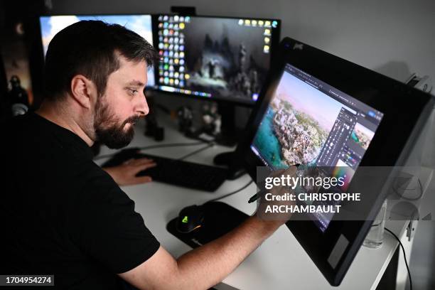 Graphic designer puts the final touches to a scene of Ubisoft's forthcoming video game "Assassin's Creed Mirage" at the Ubisoft studio in Bordeaux,...