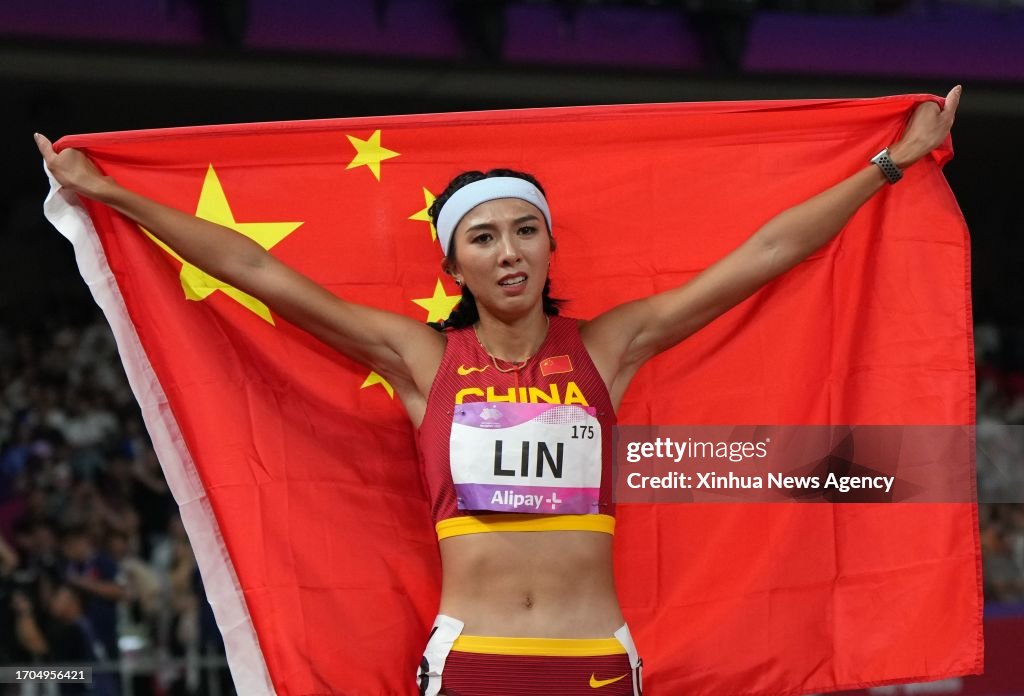 Lin Yuwei Sprinter Lin Yuwei of China celebrates after the Women's 100m Hurdles Final of ...