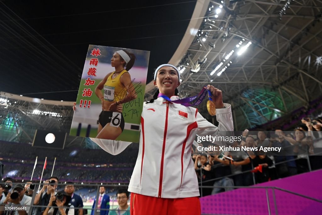 Lin Yuwei Sprinter Gold medalist Lin Yuwei of China poses with her poster after the ...
