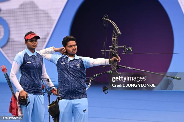 India's Jyothi Surekha Vennam and Ojas Pravin Deotale compete against Kazakhstan in the archery compound mixed team semi-final match during the 2022...