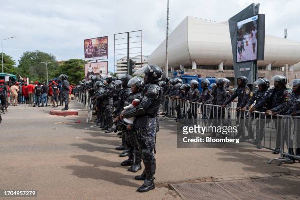 Police officers in riot gear stand guard during the 'Occupy Bank of Ghana' protest in Accra, Ghana, on Tuesday, Oct. 3, 2023. The demonstration is...