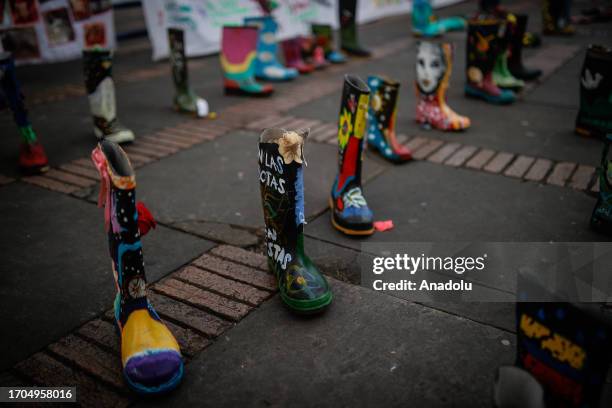 Painted Gumboots are seen during the recognition and public apology of the State by the Minister of Defense, Ivan Velasquez for the extrajudicial...