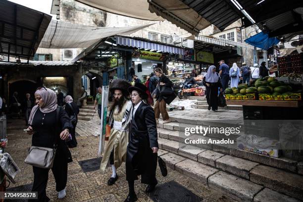 Activist Jewish settlers, who are under the protection of Israeli police, storm Al-Aqsa Mosque on 5th day of Sukkot holiday through Bab al-Qattanin ,...