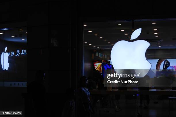 An Apple LOGO is seen outside a store that exclusively sells Apple products in Shanghai, China, October 3, 2023.