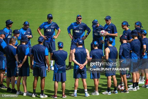 New Zealand players huddle during a training session at the Narendra Modi Stadium in Ahmedabad on October 4 ahead of their 2023 ICC men's cricket...