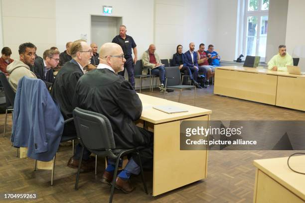 October 2023, Brandenburg, Brandenburg/Havel: Arafat Abou-Chaker and rapper Bushido meet in a courtroom at the Higher Regional Court during the...