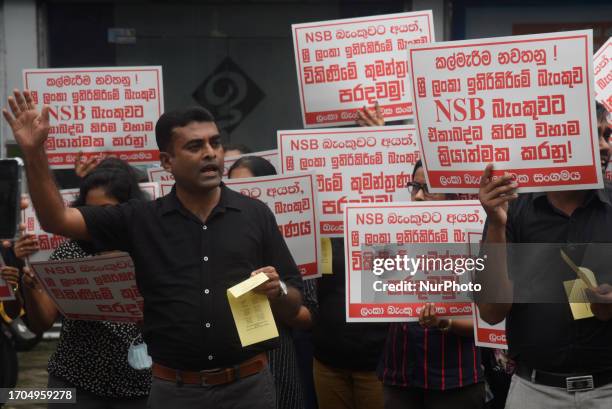 Members of Ceylon Bank Employees Union protest in front of Sri Lanka Savings Bank, They demand don't merge National Savings Bank and Sri Lanka...