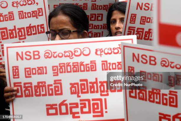 Members of Ceylon Bank Employees Union protest in front of Sri Lanka Savings Bank, They demand don't merge National Savings Bank and Sri Lanka...