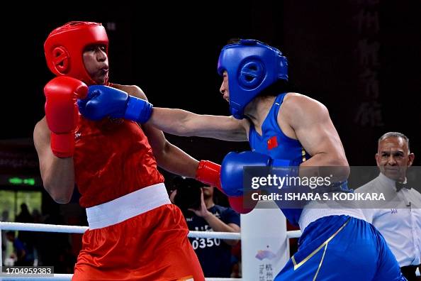 Li Quan Boxing China's LI Qian competes against India's Lovlina Borgohain in the ...