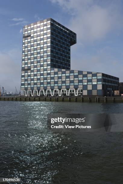 General exterior view with River Maas in foreground, Scheepvaart en Transport College, Rotterdam, Netherlands, Architect: Neutelings Riedijk, 2005.