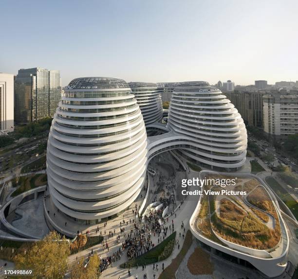 Elevated view of complex with landscaped green and cityscape, Galaxy Soho, Beijing, China, Architect: Zaha Hadid Architects, 2012.