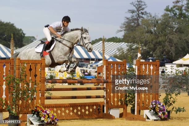 Horse And Rider Taking A Jump During Competition At Hits In Ocala, Florida, USA.