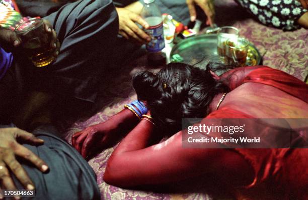 Fatima, a Bangladeshi migrant working as a low-paid prostitute in a central Calcutta brothel. She had been sold into the profession by her husband in...