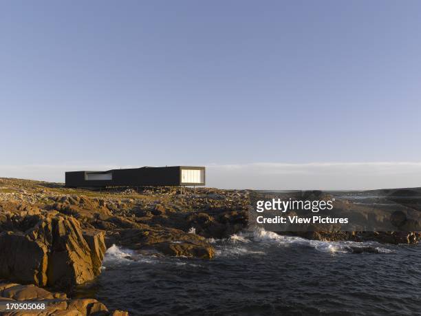 Early morning view of Long Studio, from beach, Long Studio, Fogo Island, Canada, Architect: Todd Saunders, 2011.