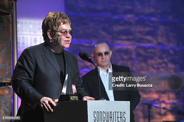 Elton John and Bernie Taupin accept the Mercer Award at the Songwriters Hall of Fame 44th Annual Induction and Awards Dinner at the New York Marriott...