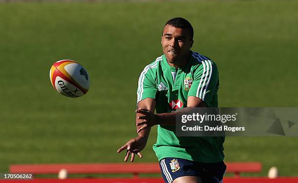 Simon Zebo, who will make his Lions debut in Saturday's match against NSW Waratahs passes the ball during the British & Irish Lions captain's run...