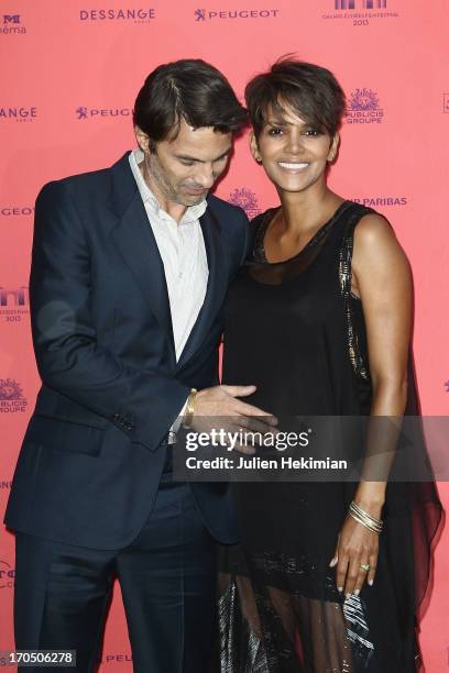 Olivier Martinez and Halle Berry attend the 'Toiles Enchantees' Red Carpet As Part of The Champs Elysees Film Festival 2013 at Publicis Champs...
