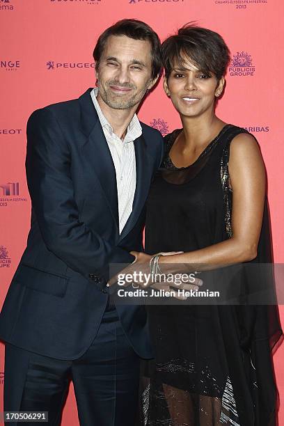 Olivier Martinez and Halle Berry attend the 'Toiles Enchantees' Red Carpet As Part of The Champs Elysees Film Festival 2013 at Publicis Champs...