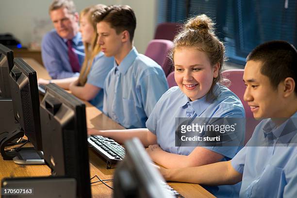 happy students in computer class - middle school stock pictures, royalty-free photos & images