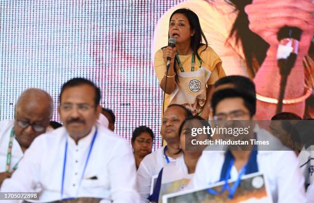 Lok Sabha MP TMC MP Mahua Moitra's speck during General Secretary of the All India Trinamool Congres Abhishek Banerjee and other party leaders sit on...