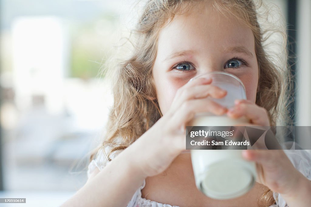 Girl drinking glass of milk