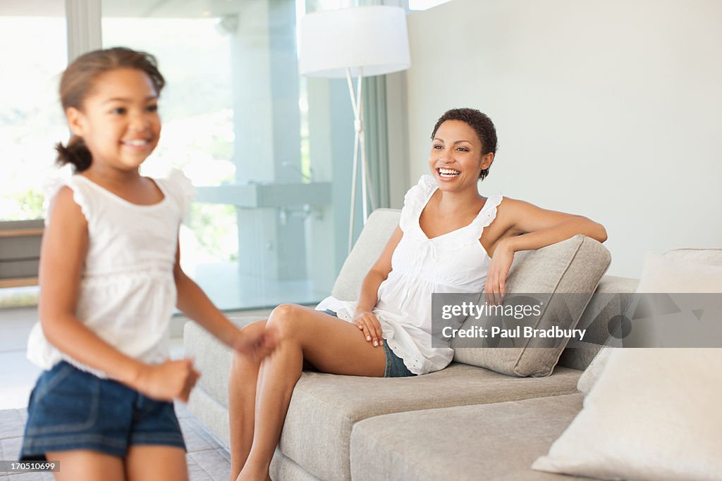 Woman and daughter in living room