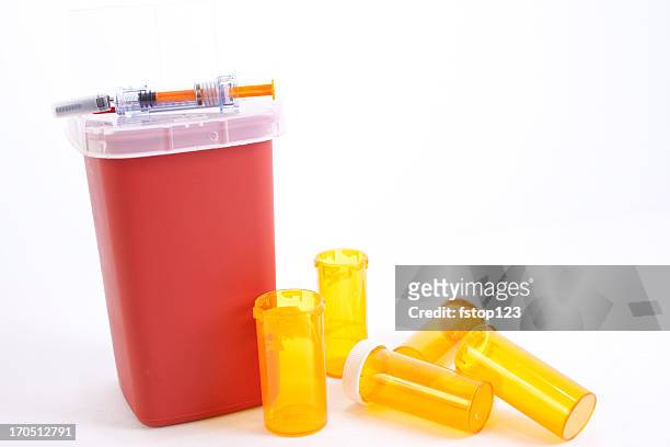discarded meds.  empty medicine bottles and syringe. sharps container. - collection 5 stock pictures, royalty-free photos & images