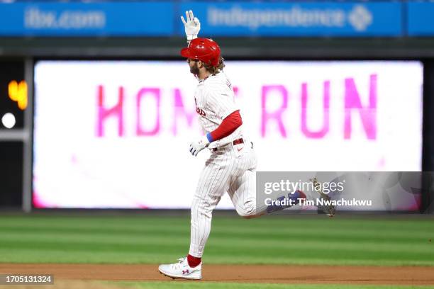 Bryce Harper of the Philadelphia Phillies rounds bases after hitting a solo home run during the seventh inning against the Pittsburgh Pirates at...