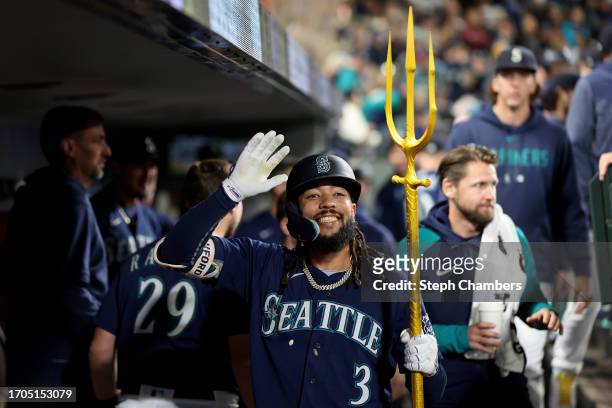 Crawford of the Seattle Mariners celebrates with the team's home run trident after his solo home run during the first inning against the Houston...