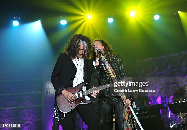 Joe Perry and Steven Tyler of Aerosmith perform at the Songwriters Hall of Fame 44th Annual Induction and Awards Dinner at the New York Marriott...