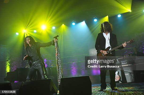 Steven Tyler and Joe Perry of Aerosmith perform at the Songwriters Hall of Fame 44th Annual Induction and Awards Dinner at the New York Marriott...