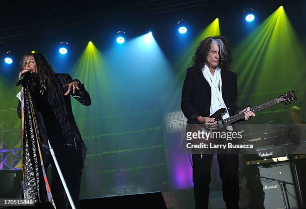 Steven Tyler and Joe Perry of Aerosmith perform at the Songwriters Hall of Fame 44th Annual Induction and Awards Dinner at the New York Marriott...