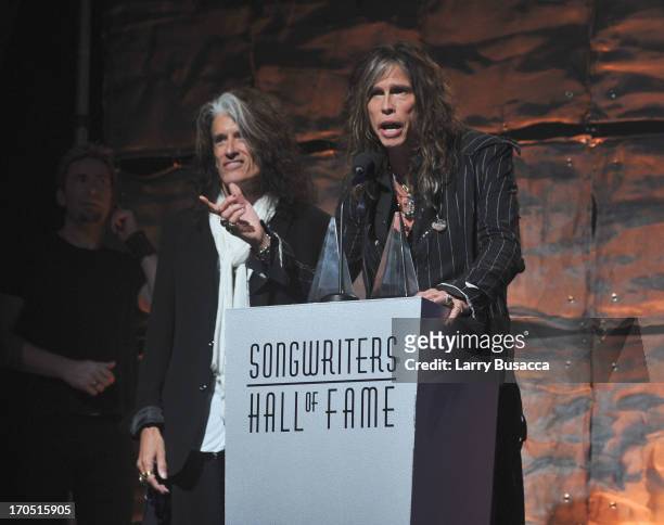 Joe Perry and Steven Tyler of Aerosmith speak at the Songwriters Hall of Fame 44th Annual Induction and Awards Dinner at the New York Marriott...