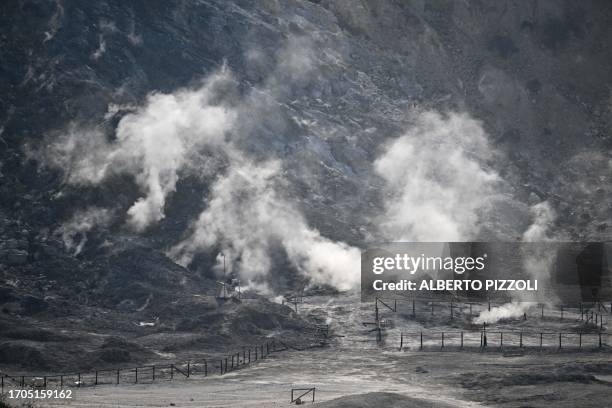 General view shows smoke from the "solfatara" at the Campi Flegrei a volcanic region close to Naples, on October 4, 2023 in Pozzuoli. Growing...