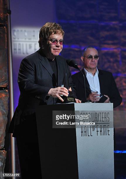 Elton John and Bernie Taupin speak at the Songwriters Hall of Fame 44th Annual Induction and Awards Dinner at the New York Marriott Marquis on June...