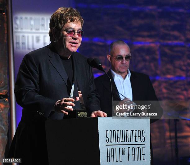 Elton John and Bernie Taupin speak at the Songwriters Hall of Fame 44th Annual Induction and Awards Dinner at the New York Marriott Marquis on June...