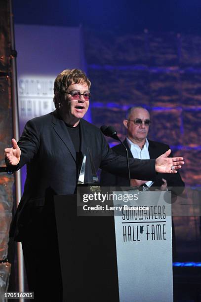 Elton John and Bernie Taupin speak at the Songwriters Hall of Fame 44th Annual Induction and Awards Dinner at the New York Marriott Marquis on June...