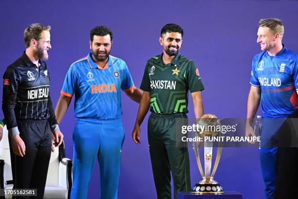 India's captain Rohit Sharma with his counterparts New Zealand's Kane Williamson , Pakistan's Babar Azam and England's Jos Buttler speak as they...