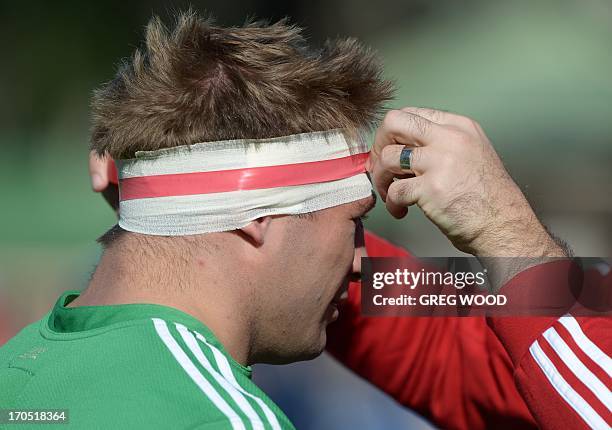 British and Irish Lions rugby union player Tom Youngs prepares for a team training session during the captain's run in Sydney on June 14, 2013. The...