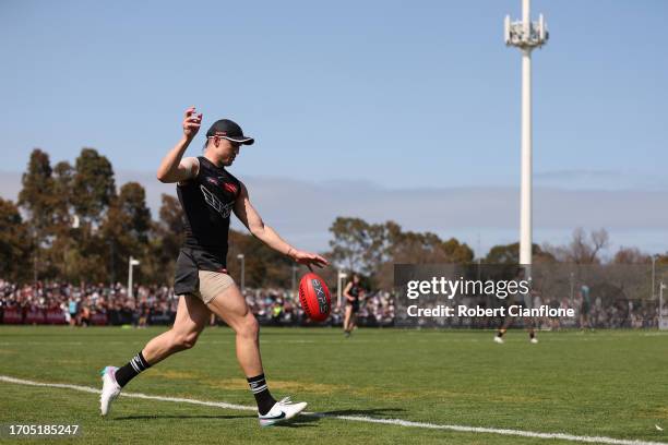 Brayden Maynard of the Magpies kicks the ball during a Collingwood Magpies AFL training session at AIA Centre on September 28, 2023 in Melbourne,...