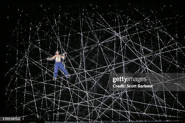 Actor Chris Ryan who plays Jack Driscoll climbs a giant spider web on Skull Island trying to find Ann Darrow as he performs during a "King Kong"...