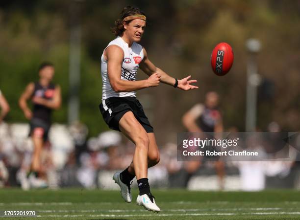 Jack Ginnivan of the Magpies kicks the ball during a Collingwood Magpies AFL training session at AIA Centre on September 28, 2023 in Melbourne,...
