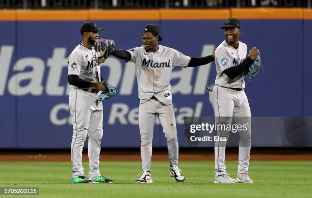 Bryan De La Cruz,Jazz Chisholm Jr. #2 and Jesus Sanchez of the Miami Marlins celebrate the win over the New York Mets during game two of a double...