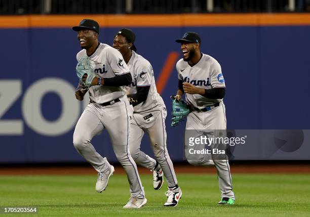 Bryan De La Cruz,Jazz Chisholm Jr. #2 and Jesus Sanchez of the Miami Marlins celebrate the win over the New York Mets during game two of a double...