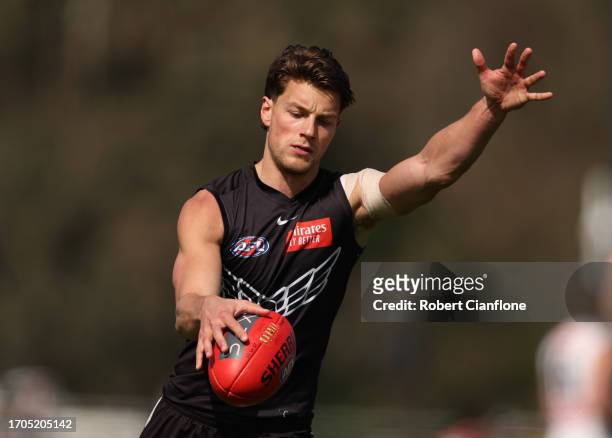 Patrick Lipinski of the Magpies controls the ball during a Collingwood Magpies AFL training session at AIA Centre on September 28, 2023 in Melbourne,...